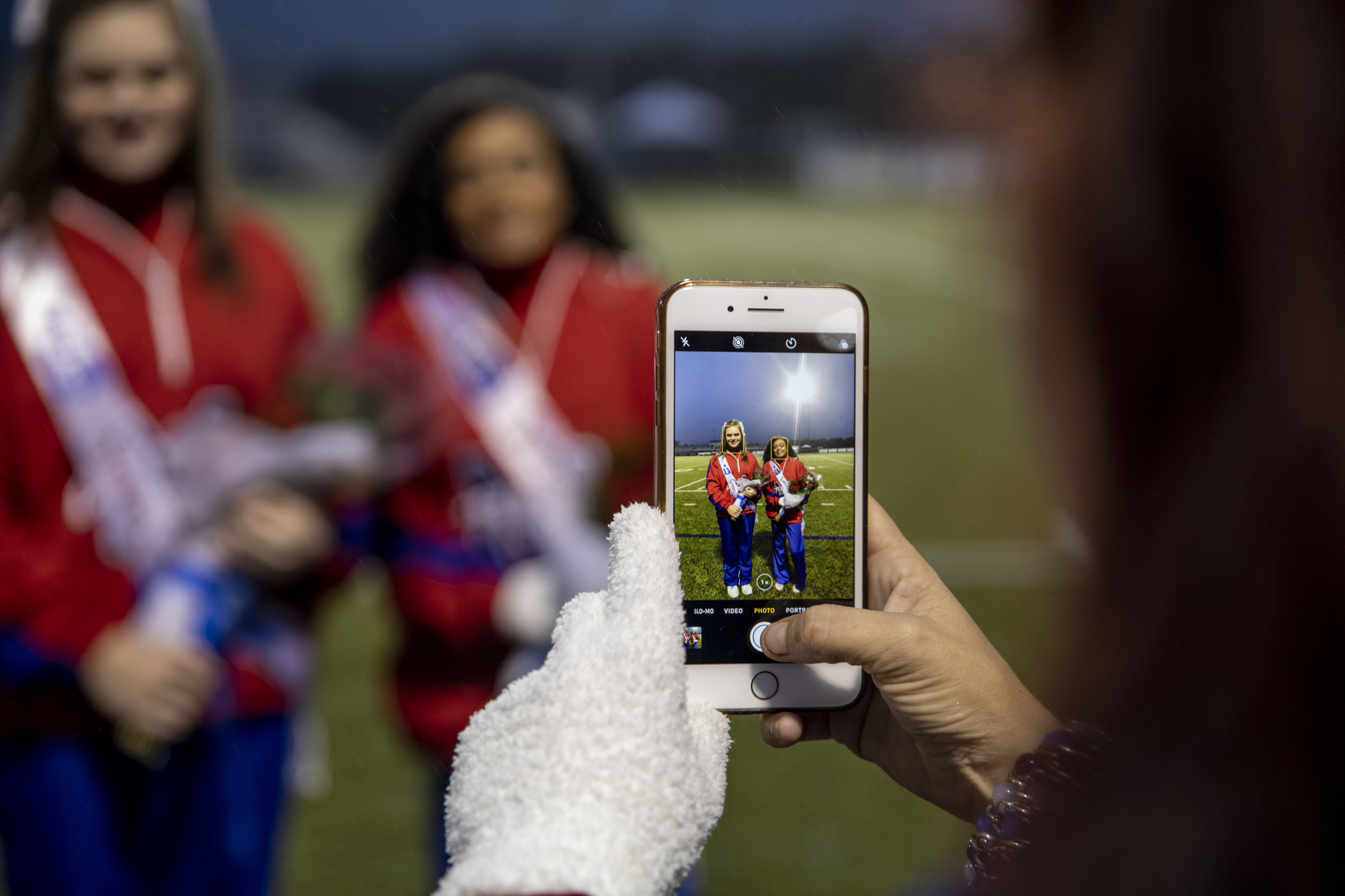 Alana poses for a photo with another senior on the cheerleading team.